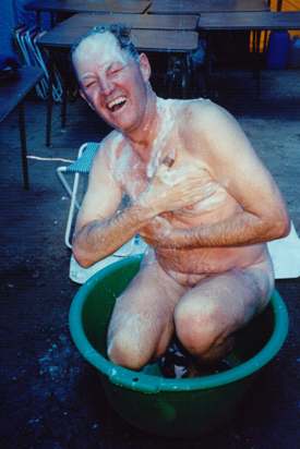 Mike Waterworth showering at base camp on Aconcagua